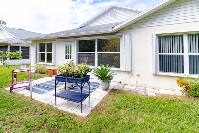 back of house with a yard and a patio area
