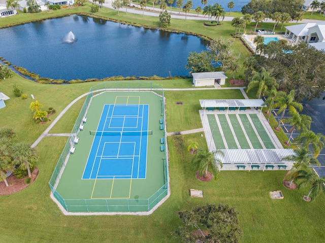 birds eye view of property with a water view