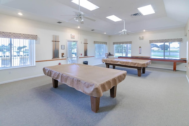 recreation room featuring a skylight, ceiling fan, carpet floors, and billiards