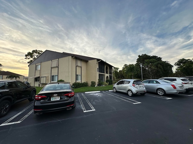 view of parking at dusk