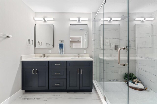 bathroom featuring vanity and an enclosed shower