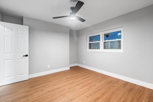 unfurnished room featuring light wood-type flooring and ceiling fan