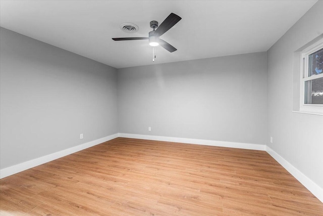 spare room featuring light wood-type flooring and ceiling fan