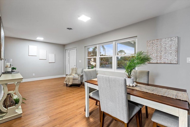 dining area with light wood-type flooring