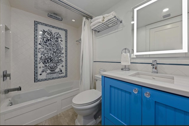 full bath with wood finished floors, shower / bath combo with shower curtain, toilet, vanity, and visible vents