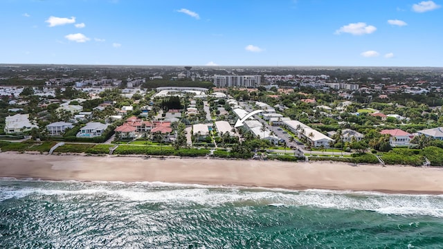 aerial view with a view of the beach, a residential view, and a water view