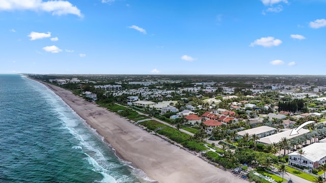 aerial view featuring a residential view, a view of the beach, and a water view