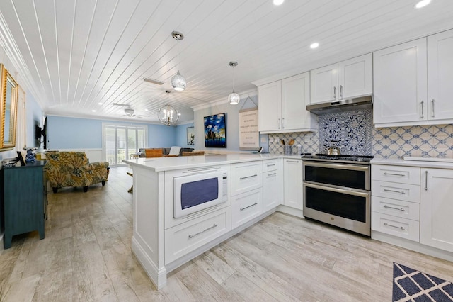 kitchen with under cabinet range hood, range with two ovens, white microwave, a peninsula, and wood ceiling