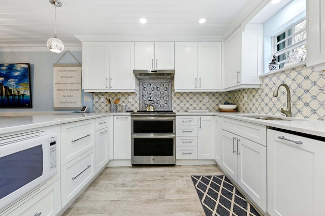 kitchen featuring white cabinets, a sink, light countertops, range with two ovens, and white microwave