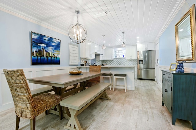 dining space featuring ornamental molding, wood ceiling, a chandelier, and light wood-style floors
