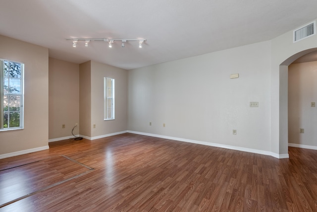 unfurnished room with hardwood / wood-style floors