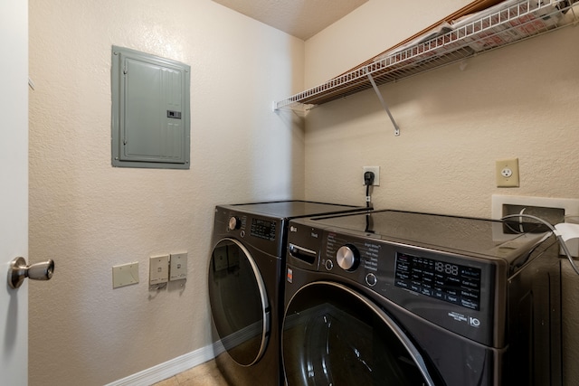 laundry room featuring electric panel and washing machine and dryer