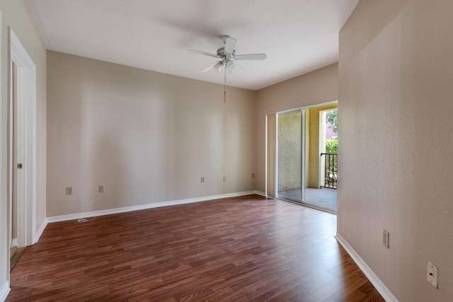 unfurnished room with dark wood-type flooring and ceiling fan