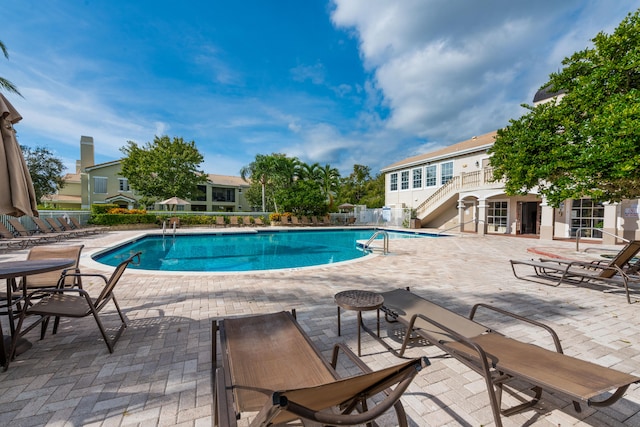 view of swimming pool with a patio area