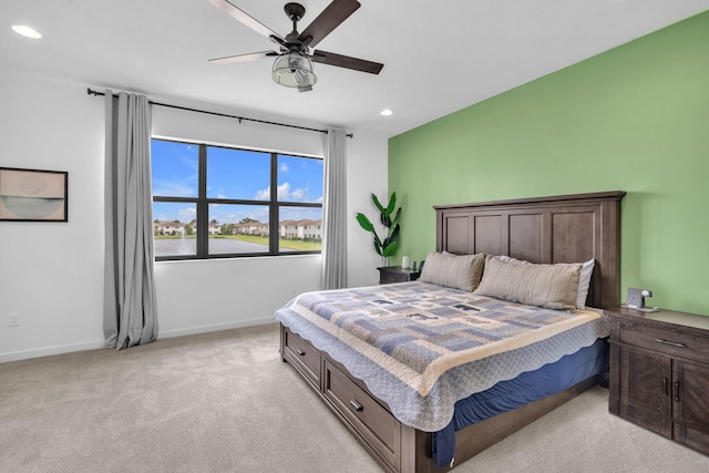 bedroom featuring recessed lighting, light carpet, ceiling fan, and baseboards