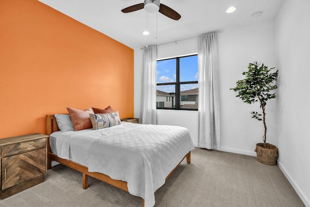 bedroom with recessed lighting, ceiling fan, baseboards, and light colored carpet