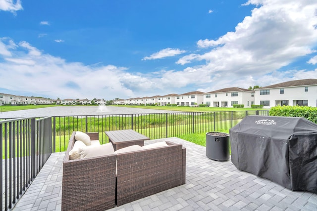 view of patio featuring a grill and a residential view