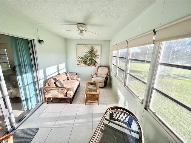 sunroom featuring vaulted ceiling and ceiling fan