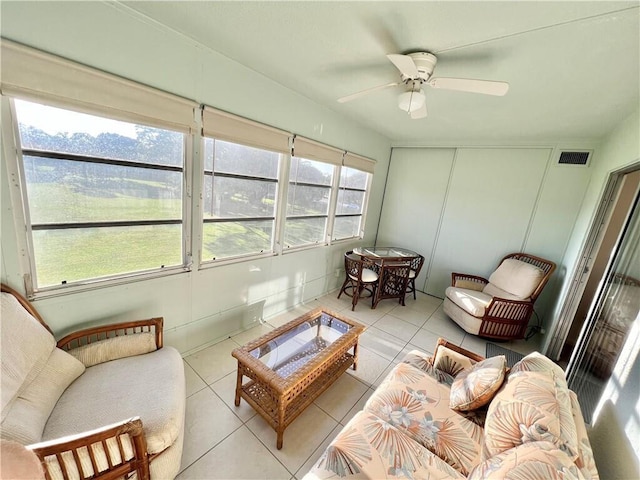 sunroom featuring ceiling fan and vaulted ceiling