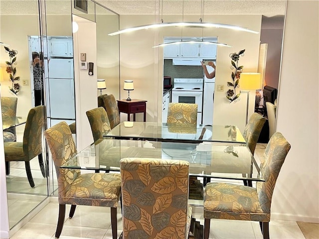 dining area with light tile patterned floors