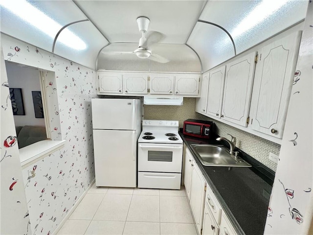 kitchen featuring white cabinets, light tile patterned floors, sink, ventilation hood, and white appliances