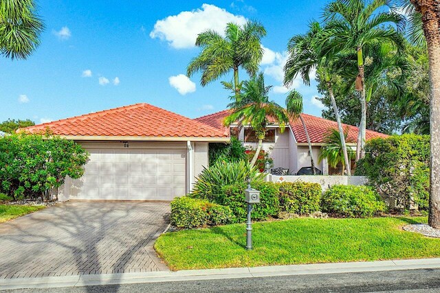 view of front of property with a garage