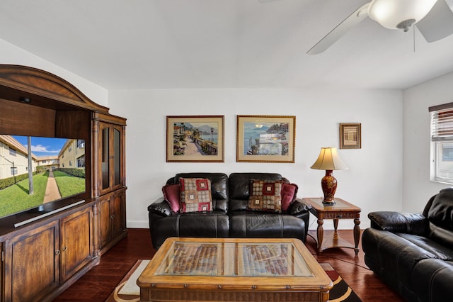 living room with ceiling fan and dark hardwood / wood-style floors