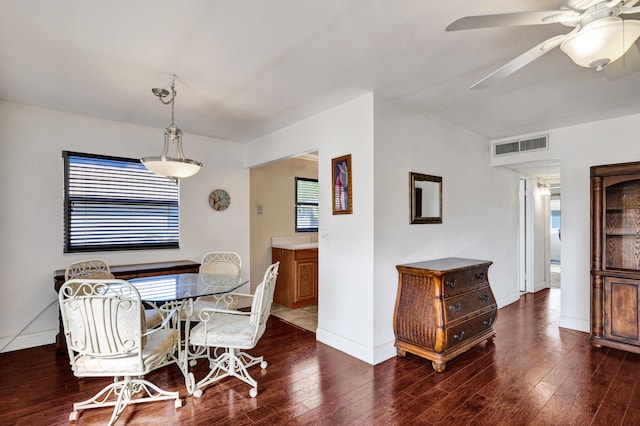 dining area featuring dark hardwood / wood-style floors and ceiling fan