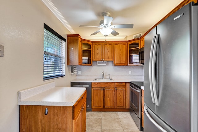 kitchen featuring sink, ceiling fan, stainless steel appliances, crown molding, and light tile patterned floors