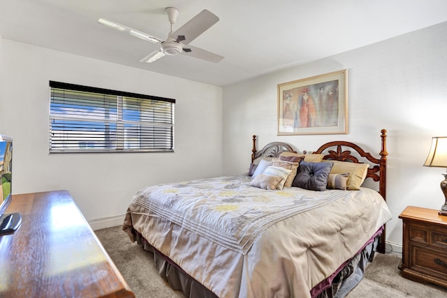 bedroom featuring ceiling fan and light colored carpet