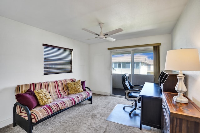 home office featuring ceiling fan and light colored carpet