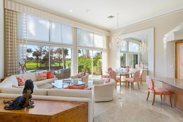 sunroom / solarium featuring an inviting chandelier