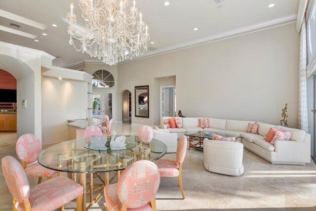 dining space featuring ornamental molding and a chandelier