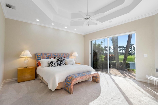 carpeted bedroom featuring access to exterior, crown molding, a raised ceiling, and ceiling fan