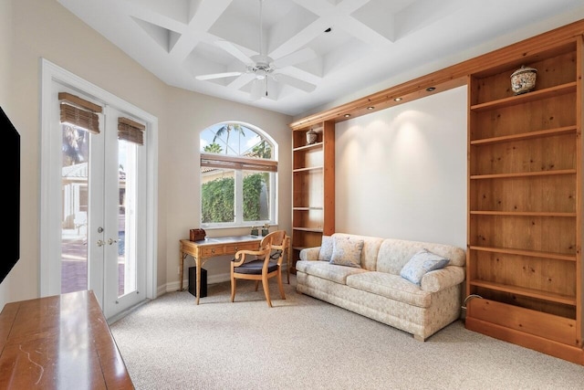 carpeted office with coffered ceiling, beam ceiling, french doors, and ceiling fan