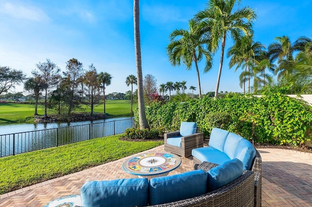 view of patio / terrace featuring an outdoor living space and a water view