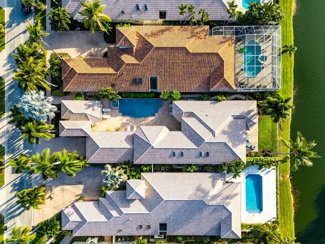 birds eye view of property with a water view