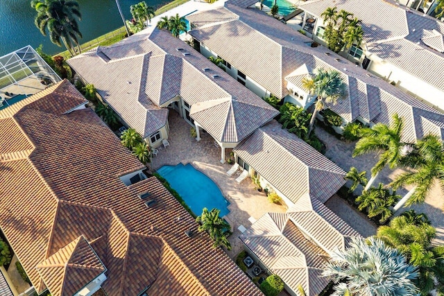 birds eye view of property with a water view