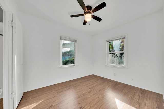 unfurnished room featuring ceiling fan and hardwood / wood-style flooring