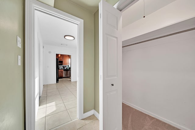 hallway featuring light tile patterned floors