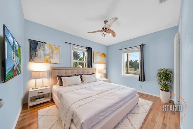 bedroom featuring light hardwood / wood-style flooring and ceiling fan