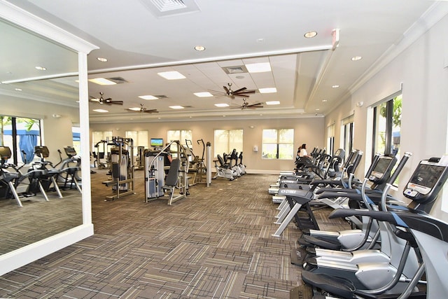 gym featuring ornamental molding and dark carpet