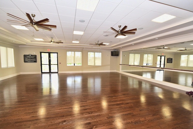 spare room with french doors, a raised ceiling, and dark hardwood / wood-style flooring