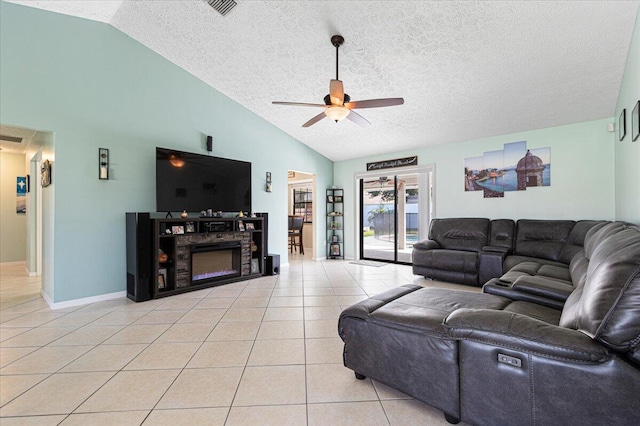 living room with ceiling fan, high vaulted ceiling, a textured ceiling, and light tile patterned flooring