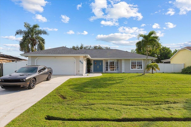 ranch-style home featuring a front lawn and a garage