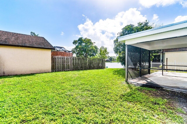 view of yard with a patio and a sunroom