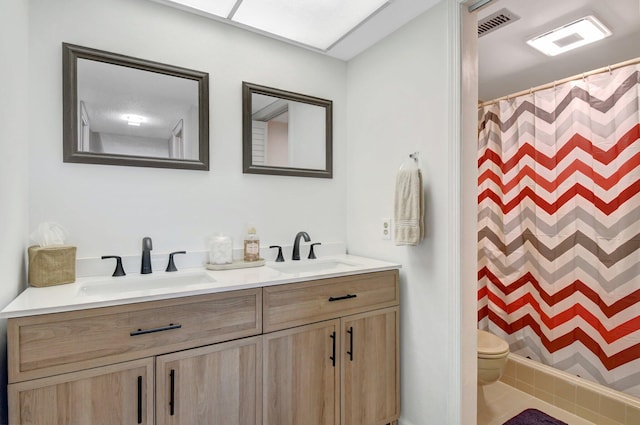 bathroom with vanity, toilet, and a shower with shower curtain