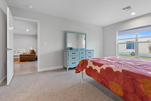 bedroom featuring light carpet