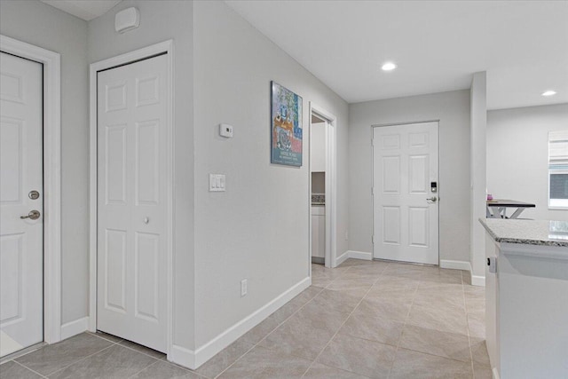 hall with light tile patterned flooring