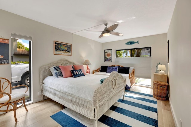 bedroom with light hardwood / wood-style flooring and ceiling fan